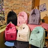 纯色双肩包帆布书包中学生女男日系韩版简约情侣背包大容量旅行包