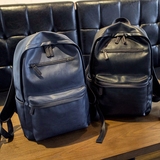代购真皮双肩包男士韩版背包时尚潮流学生书包运动休闲旅行电脑包