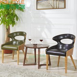 新款皮质沙发个性创意北欧椅实木休闲椅子西餐厅咖啡厅桌椅组合