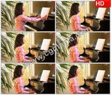 VB00606女人翻开乐谱在开心的笑着弹钢琴高清实拍视频素材