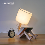 北欧宜家创意台灯时尚书房卧室床头台灯实木木头机器人折叠台灯
